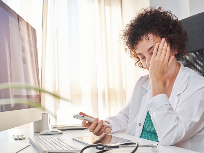 Doctor On computer unhappy